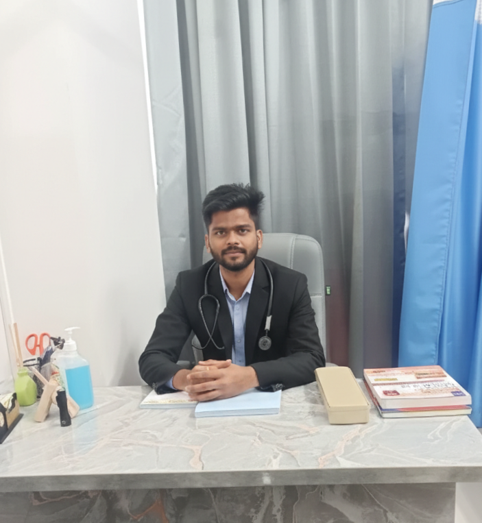 Dr. Sandesh Salunkhe at his consultation desk
